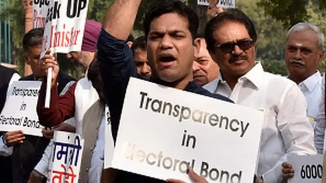 Congress MPs protest against the issue of electoral bonds in the Parliament premises during the Winter Session, demanding that Prime Minister Narendra Modi breaks his silence over it, on November 22, 2019 in New Delhi, India.