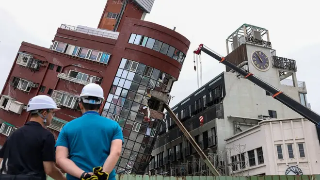 Heavy equipment is used to demolish the Uranus building, which was damaged in the April 3 earthquake, in Hualien on April 5, 2024