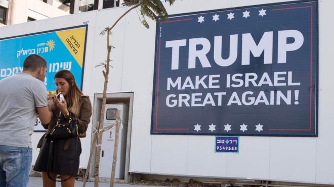 This file photo taken on November 15, 2016 shows a placard reading "Trump Make Israel Great Again" in Tel Aviv.