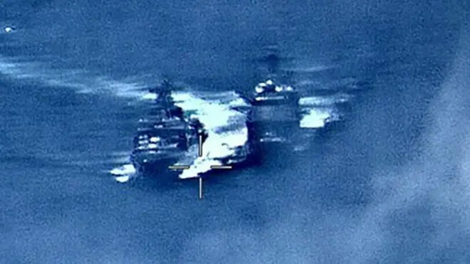 Another US Navy image showed the Russian destroyer Admiral Vinogradov (l) close to the USS Chancellorsville