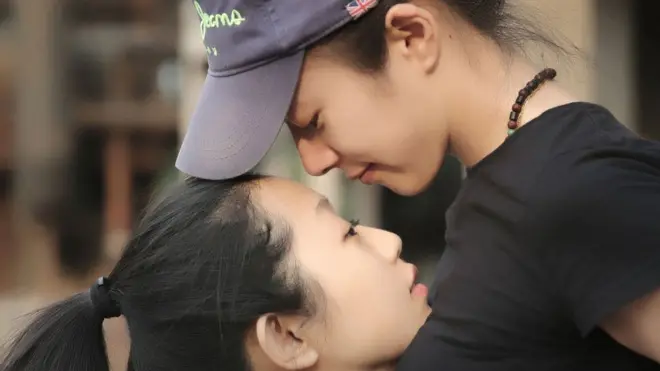 Despite being married to a man in China, Ou (right) got married to Yi in Las Vegas in September