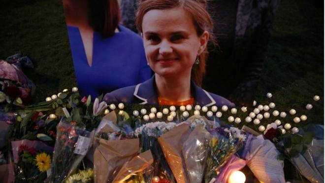 Floral tributes laid in front of picture of MP Jo Cox