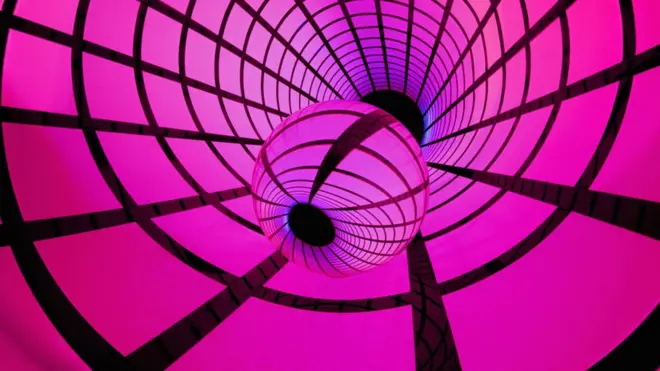 A spherical lens surrounded by a grid pattern