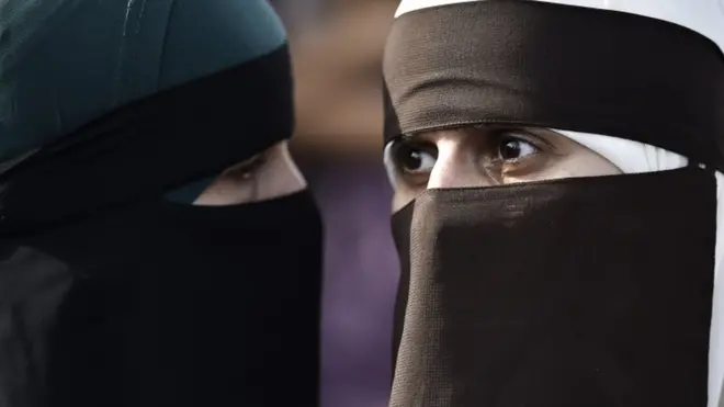 Two women wear niqabs at protest