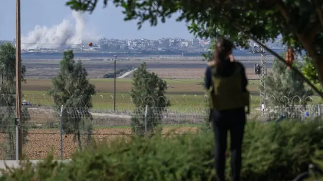 The great aunt of a recently-released hostage looks at Gaza while visiting the family's home for the first time since the Hamas attacks two months ago