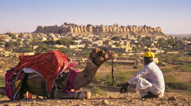 The medieval fortress of Jaisalmer rises more than 20 storeys from the dusty landscape like a golden sandcastle