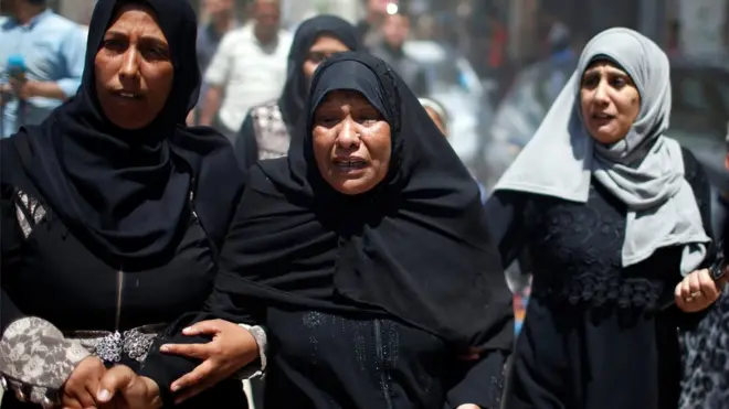 Relatives mourn at a funeral in Gaza on Tuesday