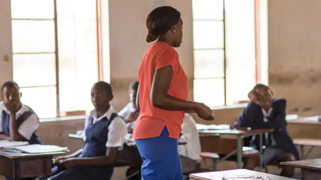 Teacher inside classroom.