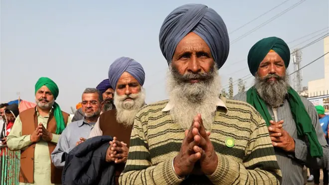 An elderly Sikh protester stands for Ardas (Sikhism worship) at Singhu border during the demonstration.Thousands of farmers from Punjab, Haryana and other states gathered for the 28th day protesting against the Government's new agricultural law, demanding to rollback these new bills.