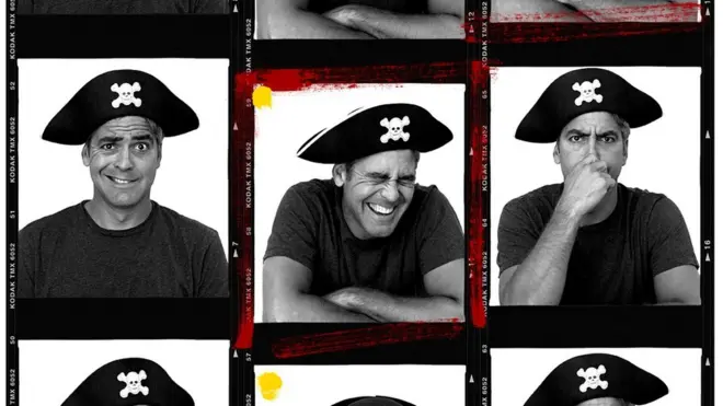 George Clooney wears a pirate hat for portraits