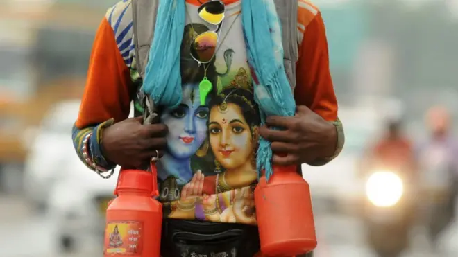 A Kanwariya seen wearing a t-shirt with the Hindu god Shiva printed on it.