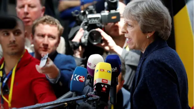 Theresa May arrives in Brussels