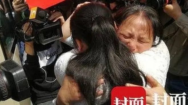 Kang Ying and her mother Liu Dengying hug after being reunited