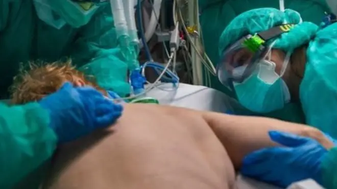 Medical team dealing with a patient in prone position