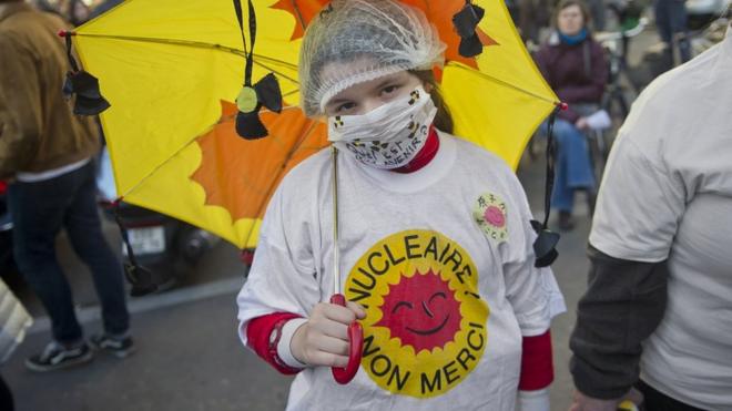 A woman wears a t-shirt reading "Nuclear energy, no thanks" at an anti-nuclear protest in France after the nuclear disaster in Japan, on March 20, 2011.