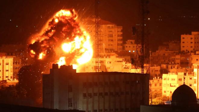 A fireball rises into the sky in Gaza City after a reported Israeli air strike on 25 March 2019
