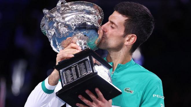 Novak Djokovic with the Australian Open trophy