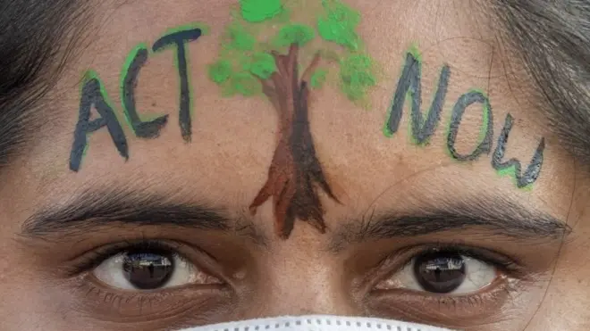 A Nepalese protester looks on during a Climate change protest to demand action from world leaders to combat the climate change crisis, in Kathmandu, Nepal, 08 November 2021