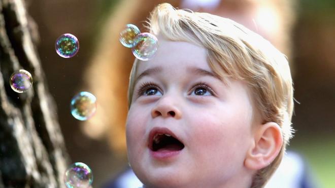 Prince George watches the bubbles