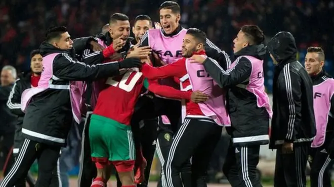 Morocco players celebrate after scoring the winner against Nigeria