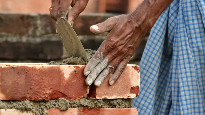 Man laying bricks