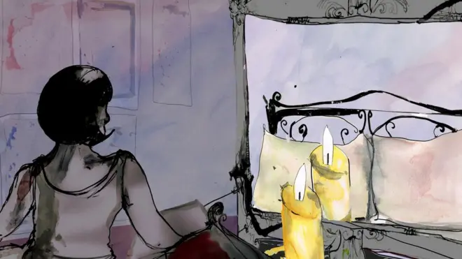 woman sitting on bed