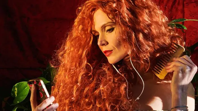 Originally I thought of just recreating Lady Lilith by Dante Rossetti and waited for the precise moment that the evening light turned golden. However as I took the image, rather than holding a mirror as Lady Lilith does, I grabbed my phone, which has become a sign of self-reflection and communication allowing us to stay connected in isolation.