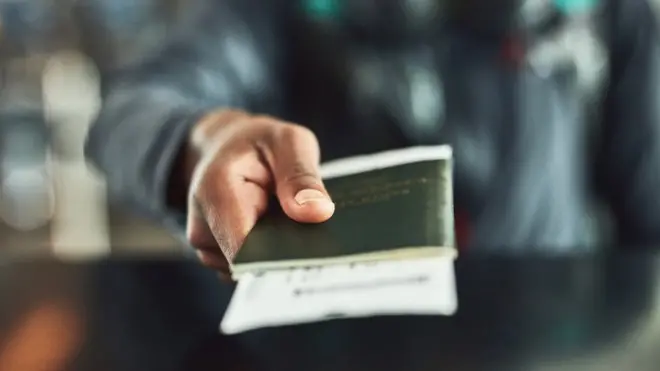 Person holding a passport
