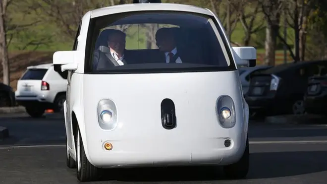 Transportation Secretary Anthony Foxx (R) and Google Chairman Eric Schmidt (L) ride in a Google self-driving car at the Google headquarters on February 2, 2015 in Mountain View, California.