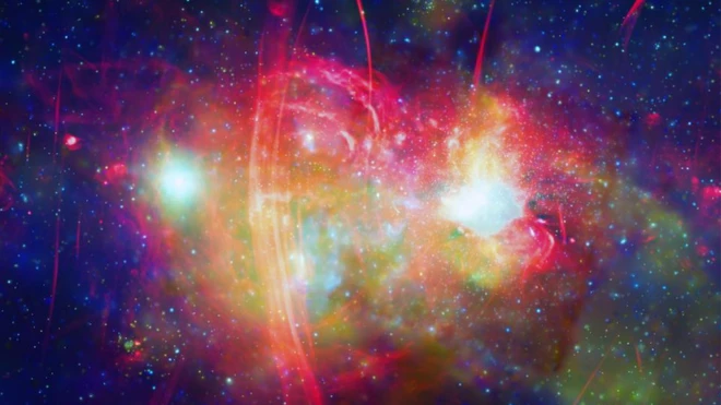 ภาพถ่ายใจกลางกาแล็กซีทางช้างเผือก ซึ่งได้จากข้อมูลรังสีเอกซ์ (สีเขียวและสีน้ำเงิน) ที่บันทึกโดยกล้องโทรทรรศน์อวกาศจันทรา รวมเข้ากับข้อมูลคลื่นวิทยุ (สีแดง) จากกล้องโทรทรรศน์ MeerKAT บนพื้นโลก