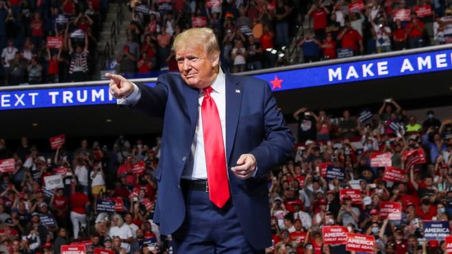 President Donald Trump points at the crowd as he enters his first re-election campaign rally in several months in the midst of the coronavirus disease (COVID-19) outbreak, at the BOK Center in Tulsa, Oklahoma, U.S., June 20, 2020