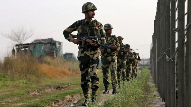 India's Border Security Force (BSF) soldiers patrol along the fenced border with Pakistan in Ranbir Singh Pura sector near Jammu February 26, 2019.