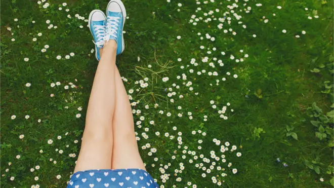 Girl with legs crossed