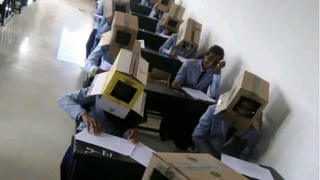 అట్టపెట్టెలతో పరీక్ష రాస్తున్న విద్యార్థులు