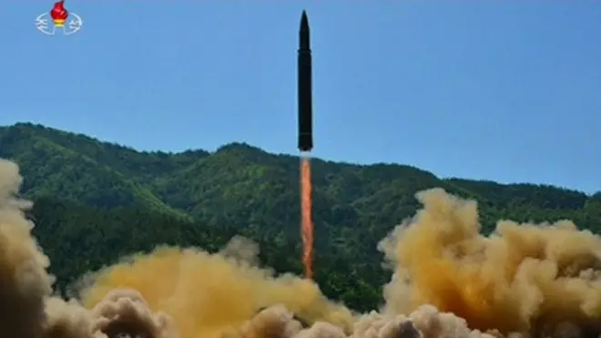 North Korean state TV released photos of the purported ICBM test launch
