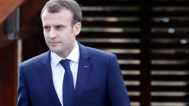 Emmanuel Macron arriving at an interview
