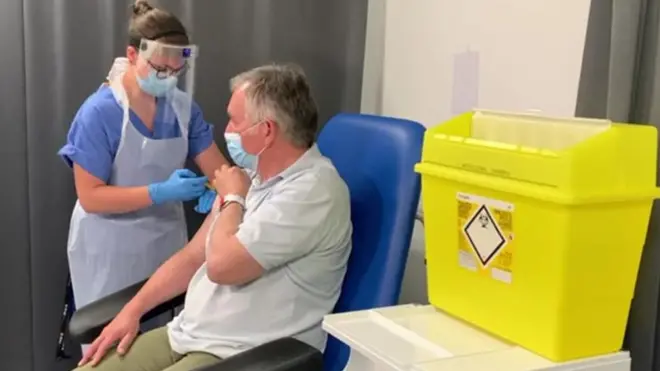 Alex Brown gets a third dose of vaccine