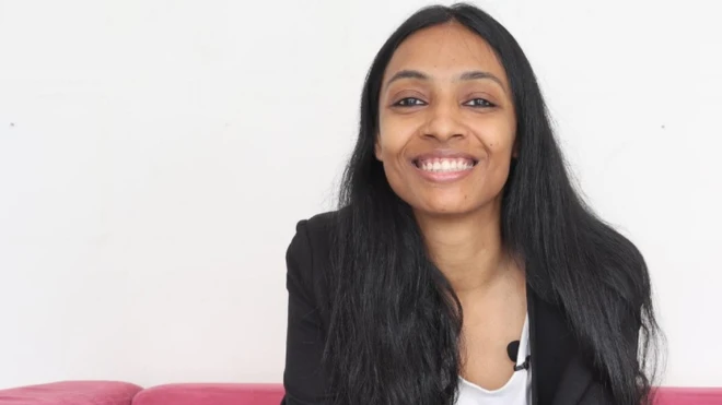 Pallavi on pink sofa
