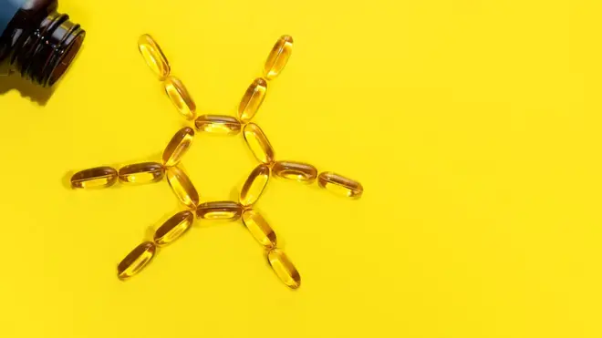 vitamin d capsules in shape of the sun