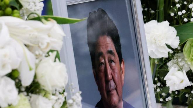 A picture of late former Japanese Prime Minister Shinzo Abe, who was shot while campaigning for a parliamentary election, is seen at Headquarters of the Japanese Liberal Democratic Party in Tokyo, Japan July 12, 2022.