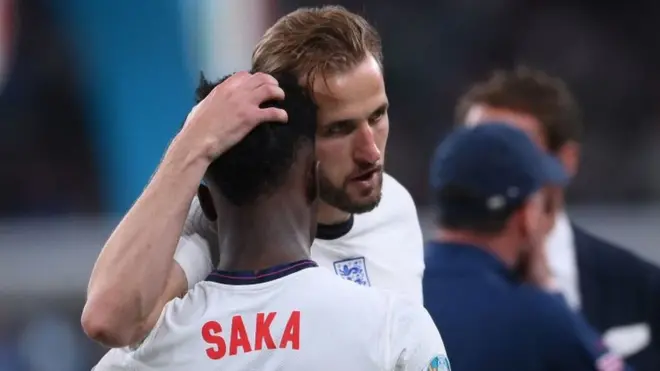 England captain Harry Kane consoles Bukayo Saka following the Euro 2020 final defeat to Italy