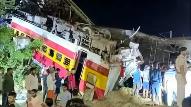 This frame grab taken from AFPTV video footage on June 2, 2023 shows flipped over train carriages after a three-train collision near Balasore, about 200 kilometres (125 miles) from Bhubaneswar, capital of eastern India's Odisha state.