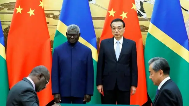 Solomon Islands Prime Minister Manasseh Sogavare, Solomon Islands Foreign Minister Jeremiah Manele, Chinese Premier Li Keqiang and Chinese State Councillor and Foreign Minister Wang Yi attend a signing ceremony at the Great Hall of the People in Beijing