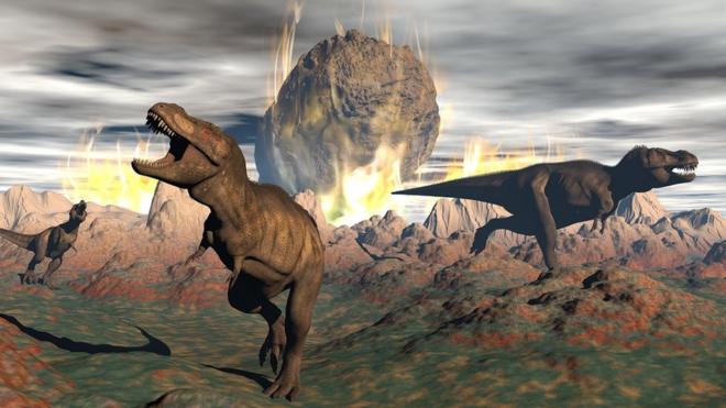 Dinosaurs running in a panic as a meteorite hits earth