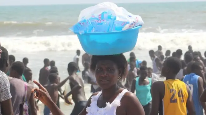Woman wey dey sell pure water for beach