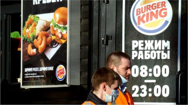 People outside a Burger King restaurant in Russia.