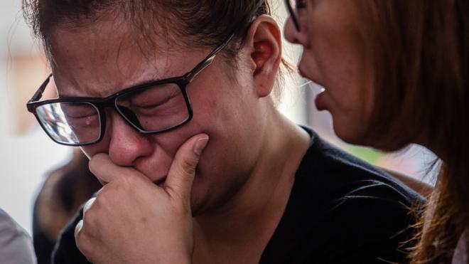 Ningsi Ayorbaba (35), weeps as await news of her husband Paul Ferdinan Ayorbaba, a victim of Lion Air flight JT 610 as reports suggest authorities have located the aircraft"s fuselage at police hospital on October 31, 2018