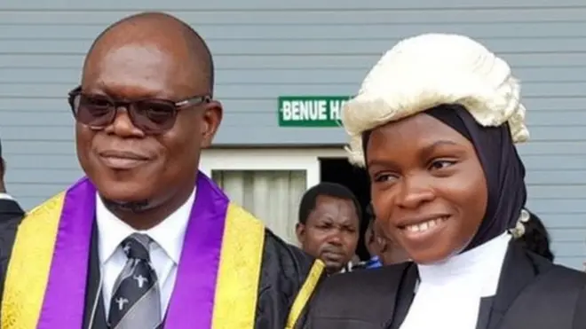 Seven months afta she refuse to remove her hijab, dem call Amasa Firdaus to bar.