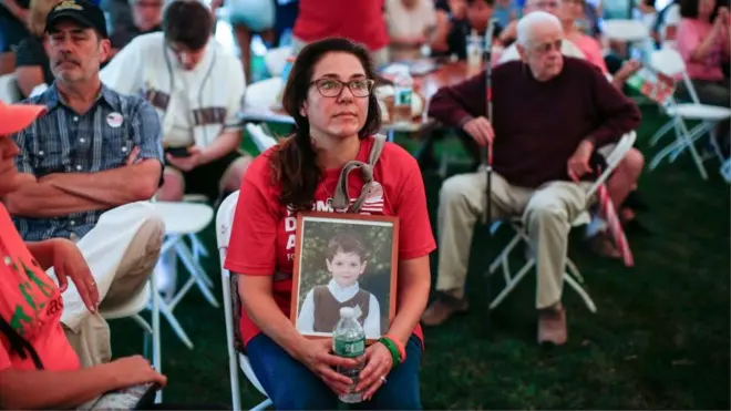 Lawsuit participant Francine Wheeler with a photograph of her son Ben, who was killed at Sandy Hook in 2012