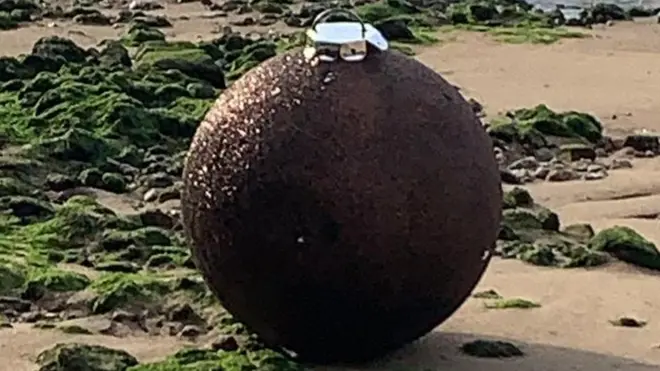 Officers were called to inspect the device - which turned out to be a giant glittery Christmas bauble.